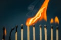 Lighting matches in a row Royalty Free Stock Photo