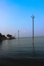 Lighting pillars are standing inside water reservoir