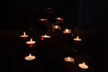 Lighting prayer candles in a church. Prayer candles in a church. Royalty Free Stock Photo