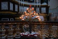 Lighting prayer candles in a church. Prayer candles in a church. Royalty Free Stock Photo