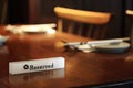 Lighting Reserved sign on a restaurant table Royalty Free Stock Photo