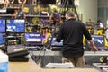 Lighting and Sound Technician and Broadcast Operator at Work in the BackStage during a Public Event