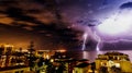 Lighting storm over a surfy beach town at night Royalty Free Stock Photo