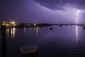 Lighting Strike Over Harbor With Purple Sky Royalty Free Stock Photo
