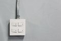 Lighting switch on grey wall Royalty Free Stock Photo