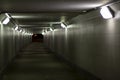 Lighting in the tunnel. Pedestrian crossing with lamps. LED light in a long tunnel under the track