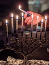 Lighting up a menorah on Hannukah