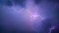 Lightning bolt between black clouds at night, amazing and dramatic view Royalty Free Stock Photo