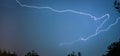 A lightning bolt creeps through the night sky over The Netherlands. Royalty Free Stock Photo