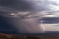 Lightning bolt and heavy rain from a monsoon storm in Arizona Royalty Free Stock Photo