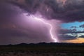 Lightning bolt from a monsoon storm against a sunset background. Royalty Free Stock Photo