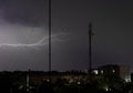 A lightning bolt over a city is always a unique event. Enchanting show of light and sound Royalty Free Stock Photo