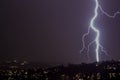 Lightning bolt storm at night in the city Royalty Free Stock Photo