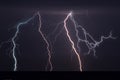 Lightning bolts strike from a summer thunderstorm. Flash Royalty Free Stock Photo