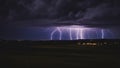 lightning city rural landscape night illuminated spectacular lightning storm, creating a contrast between the dark and the bright. Royalty Free Stock Photo