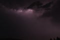 Lightning between clouds at purple sky Royalty Free Stock Photo