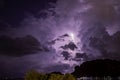 Lightning in the clouds on the sky at night Background sea and mountains