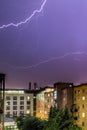 Lightning on the cloudy sky, urban city life with buildings, Austria Royalty Free Stock Photo