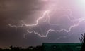 Lightning bolts creep through the sky during a severe springtime thunderstorm in Romania Royalty Free Stock Photo