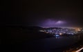 Lightning with dramatic clouds. Night thunder-storm over the mountain and the lake in Baku, Azerbaijan Royalty Free Stock Photo