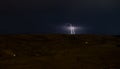 Lightning with dramatic clouds. Night thunder-storm over the mountain and the lake in Baku, Azerbaijan Royalty Free Stock Photo