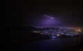 Lightning with dramatic clouds. Night thunder-storm over the mountain and the lake in Baku, Azerbaijan Royalty Free Stock Photo