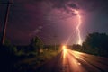 lightning illuminating a tornados path at night