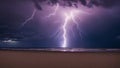 lightning in the night A serene beach at night is contrasted by the fury of a lightning storm that rages in the distance. Royalty Free Stock Photo