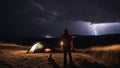 lightning night He was camping on the hill, enjoying the night sky. He didn\'t notice the storm clouds gathering about Royalty Free Stock Photo