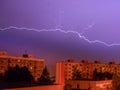 Lightning over city houses - long exposure at night Royalty Free Stock Photo