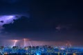 Lightning over the city at the summer storm. Dramatic, breathtaking atmospheric natural phenomenon. Royalty Free Stock Photo