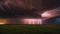 lightning over the field dramatic scene of a supercell thunderstorm and lightning bolt over a field in Kansas at sunset, Royalty Free Stock Photo