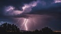 lightning over the mountains A city sleeps under a stormy sky, unaware of the dazzling lightning show above.