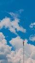 lightning rod against the background of clouds and blue sky. Royalty Free Stock Photo