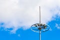 Lightning rod on the lighting pole. Protecting from lightning strikes during a thunderstorm. Safe urban environment Royalty Free Stock Photo