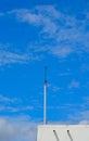 Lightning rod on roof with blue sky