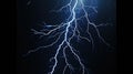 Lightning in storm at night, electric flash of thunder on dark blue sky background. Concept of thunderbolt, thunderstorm, strike, Royalty Free Stock Photo