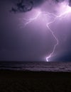 Lightning storm at night over the ocean Royalty Free Stock Photo