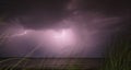 Lightning during a storm at night over the sea Royalty Free Stock Photo