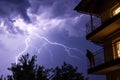 lightning storm with observer on a balcony