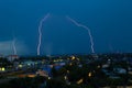 Lightning storm over city in blue light Royalty Free Stock Photo