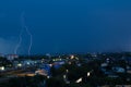 Lightning storm over city in blue light Royalty Free Stock Photo
