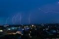 Lightning storm over city in blue light Royalty Free Stock Photo