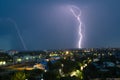 Lightning storm over city in blue light Royalty Free Stock Photo