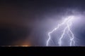 Lightning storm over a city at night Royalty Free Stock Photo