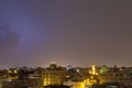 Lightning storm over city in purple light in jeddah al marwah Royalty Free Stock Photo