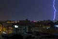 Lightning storm over city in purple light in jeddah al marwah Royalty Free Stock Photo