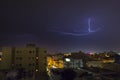 Lightning storm over city in purple light in jeddah al marwah Royalty Free Stock Photo