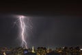 Lightning storm over the city at the summer heavy rain. Dramatic, breathtaking atmospheric natural phenomenon. Kyiv, Ukraine
