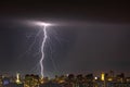 Lightning storm over the city at the summer heavy rain. Dramatic, breathtaking atmospheric natural phenomenon. Kyiv, Ukraine